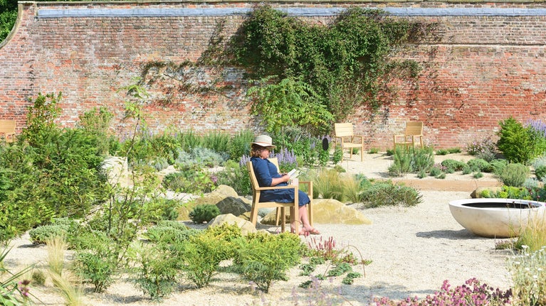 A visitor enjoys the Mediterranean Garden at Beningbrough